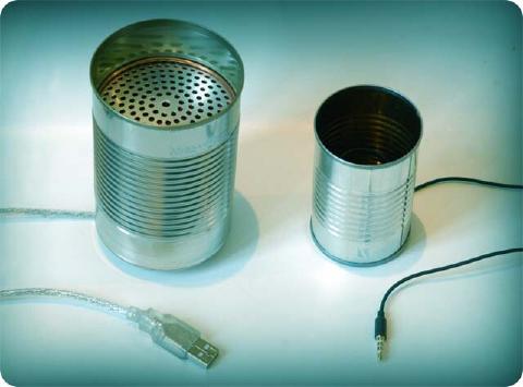 Two tin cans wired as phones, one ending in a USB plug and the other in a headphone jack